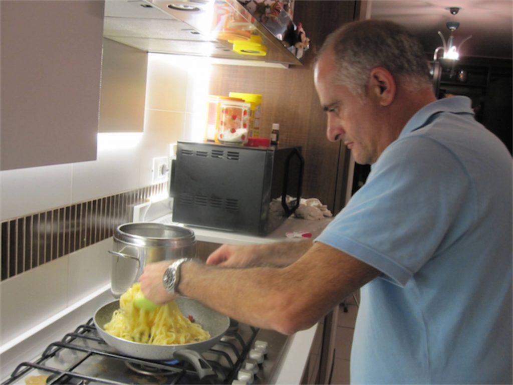 Eugenio coating the pasta